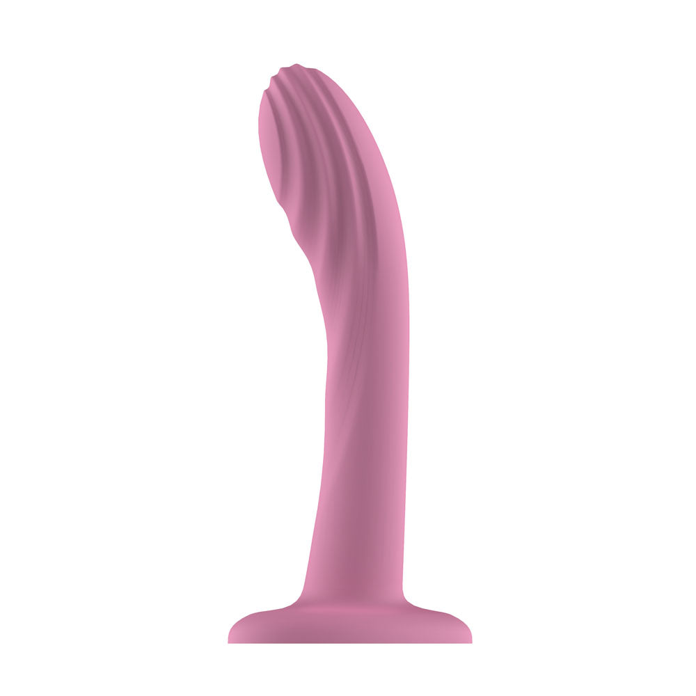 Passion Play Liquid Silicone Textured Dildo in Pink upright on its suction base
