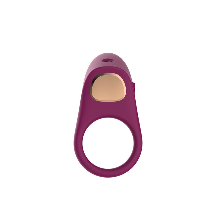 Passion Play Vibrating Cockring in Purple face on, rose gold charging plate set in the pad