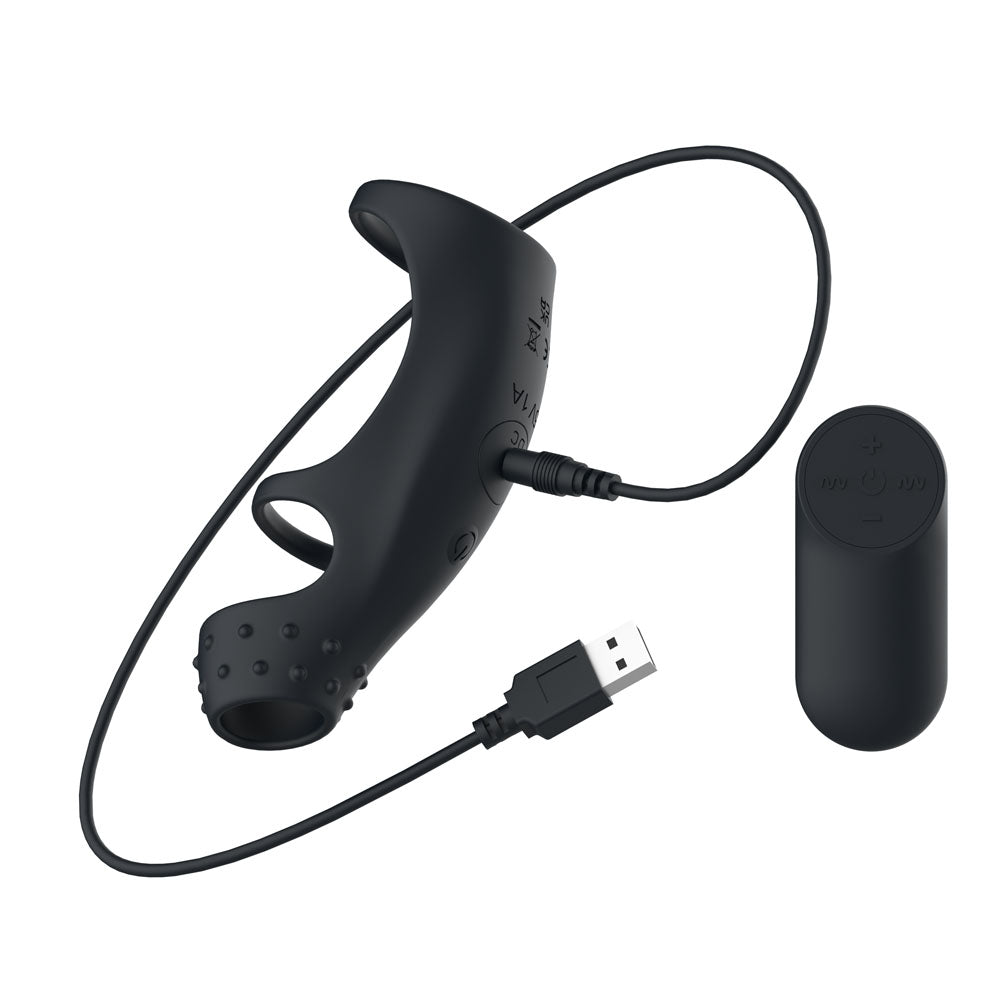 Passion Play Cockring Sleeve in Black with its USB charging cable attached, remote at right