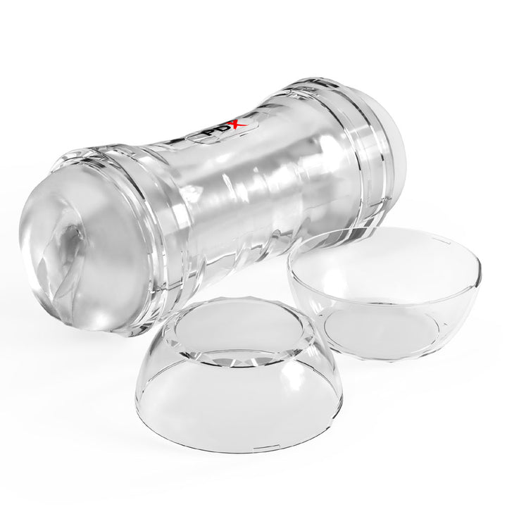 Super Flip-A-Pussy Over lying at an angle with both clear end caps removed beside it
