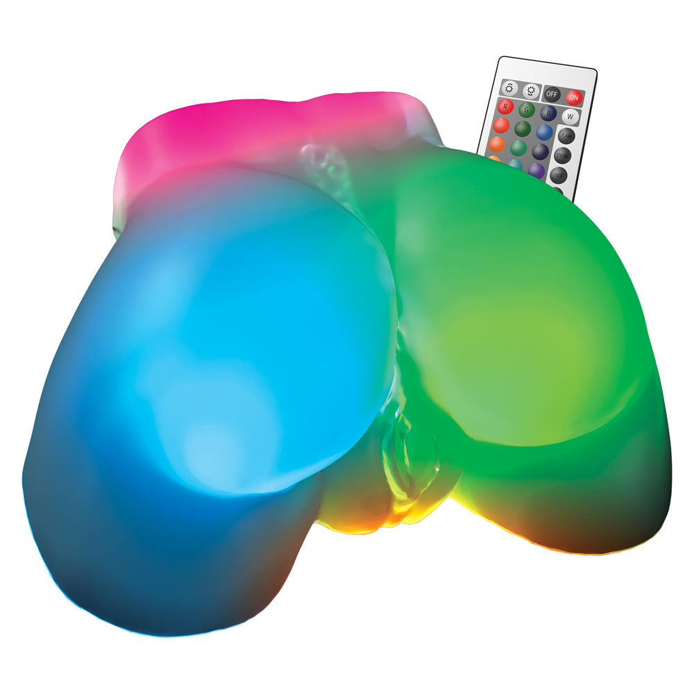 Go-Go Booty buttocks lit pink, blue and green, shown with the colour-change remote