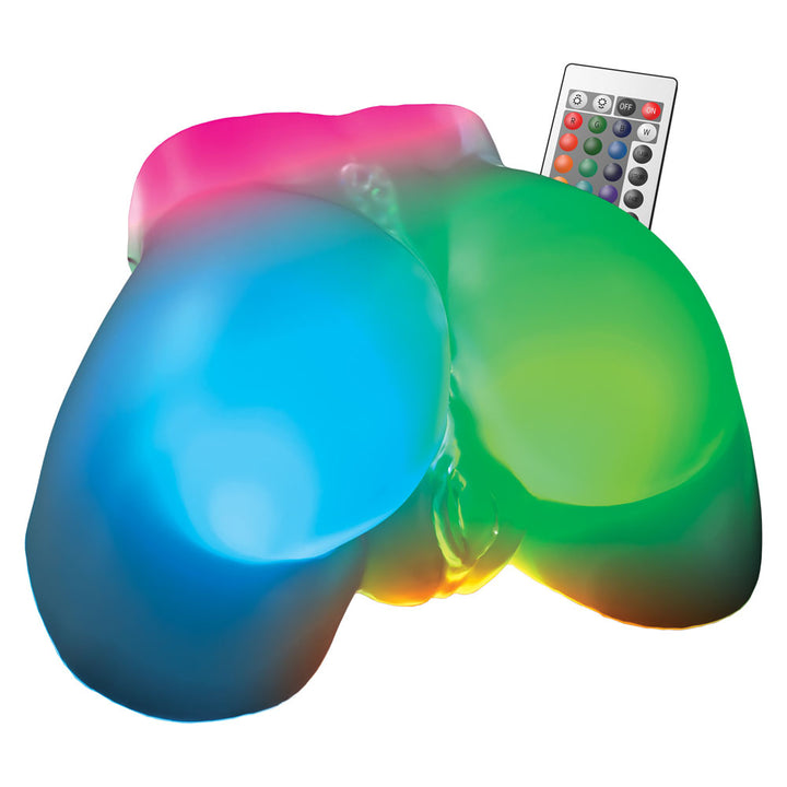 Go-Go Booty buttocks lit pink, blue and green, shown with the colour-change remote