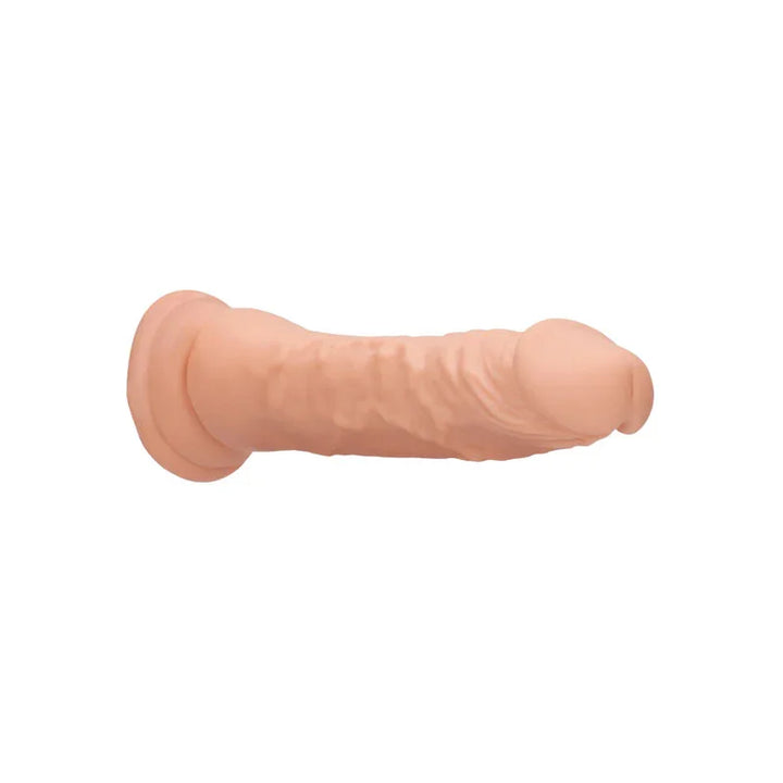 REALROCK 22.9 cm Realistic Dildo in Flesh, lying on its side showing the veined shaft