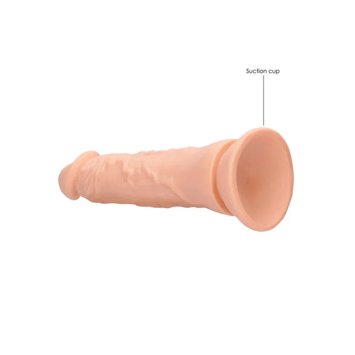 REALROCK 22.9 cm Realistic Dildo in Flesh, lying flat with the suction cup labelled