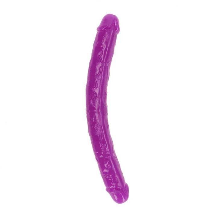 REALROCK 38 cm Glow in the Dark Double Dildo in Purple, the curved double shaft laid out on white
