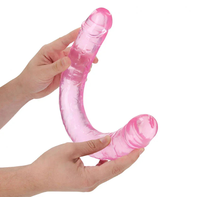 REALROCK 45 cm Double Dildo in Pink, flexed between two hands to show how far it bends