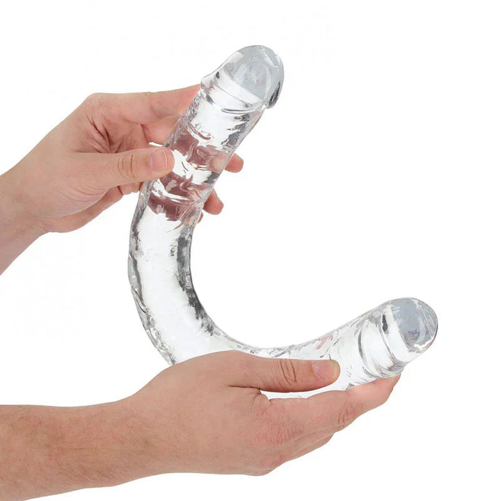 REALROCK 45 cm Double Dildo in Clear, flexed between two hands to show how far it bends