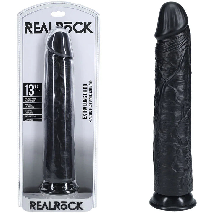 REALROCK 33 cm Extra Long Dildo in Black, blister pack beside the long veined dildo