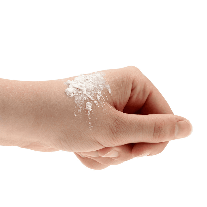 REALROCK Revive reviving powder shown with applicator puff