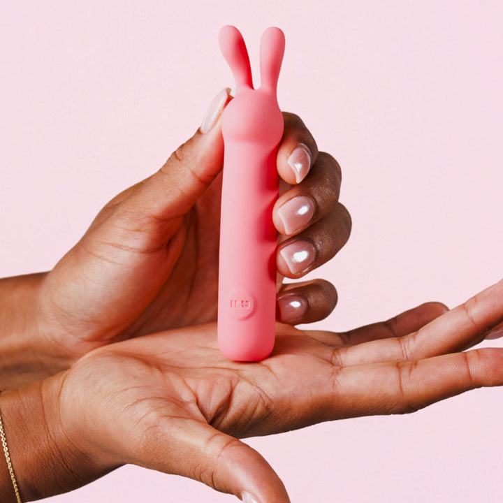 ILY The Rabbit held in an open palm to show its compact palm-sized scale