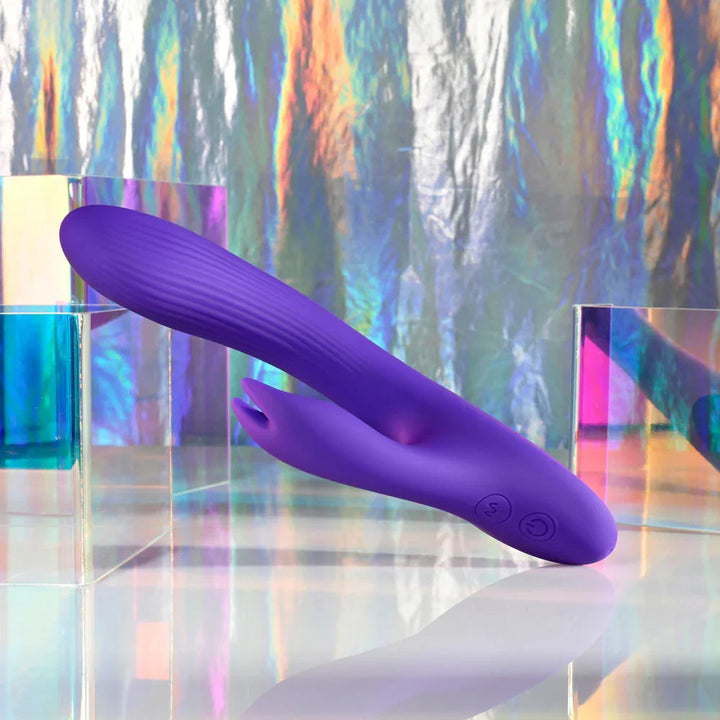 Poseable Bunny laid flat on iridescent blocks, shaft and rabbit arm straight