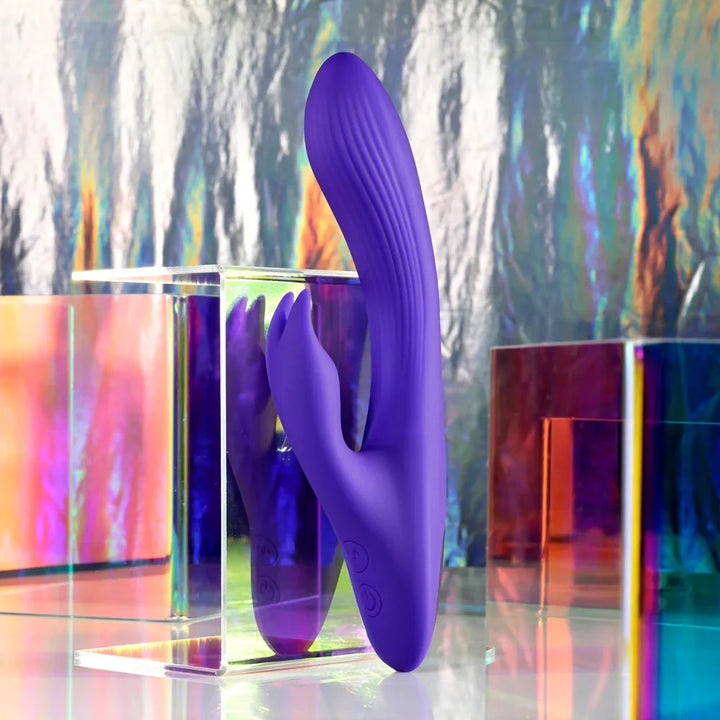 Poseable Bunny standing upright against iridescent acrylic blocks