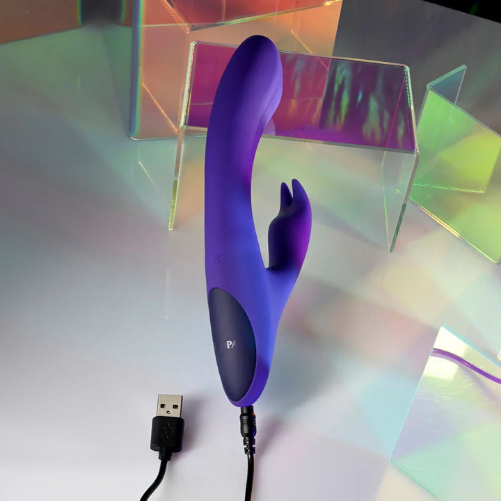Poseable Bunny with its USB charging cable plugged into the handle