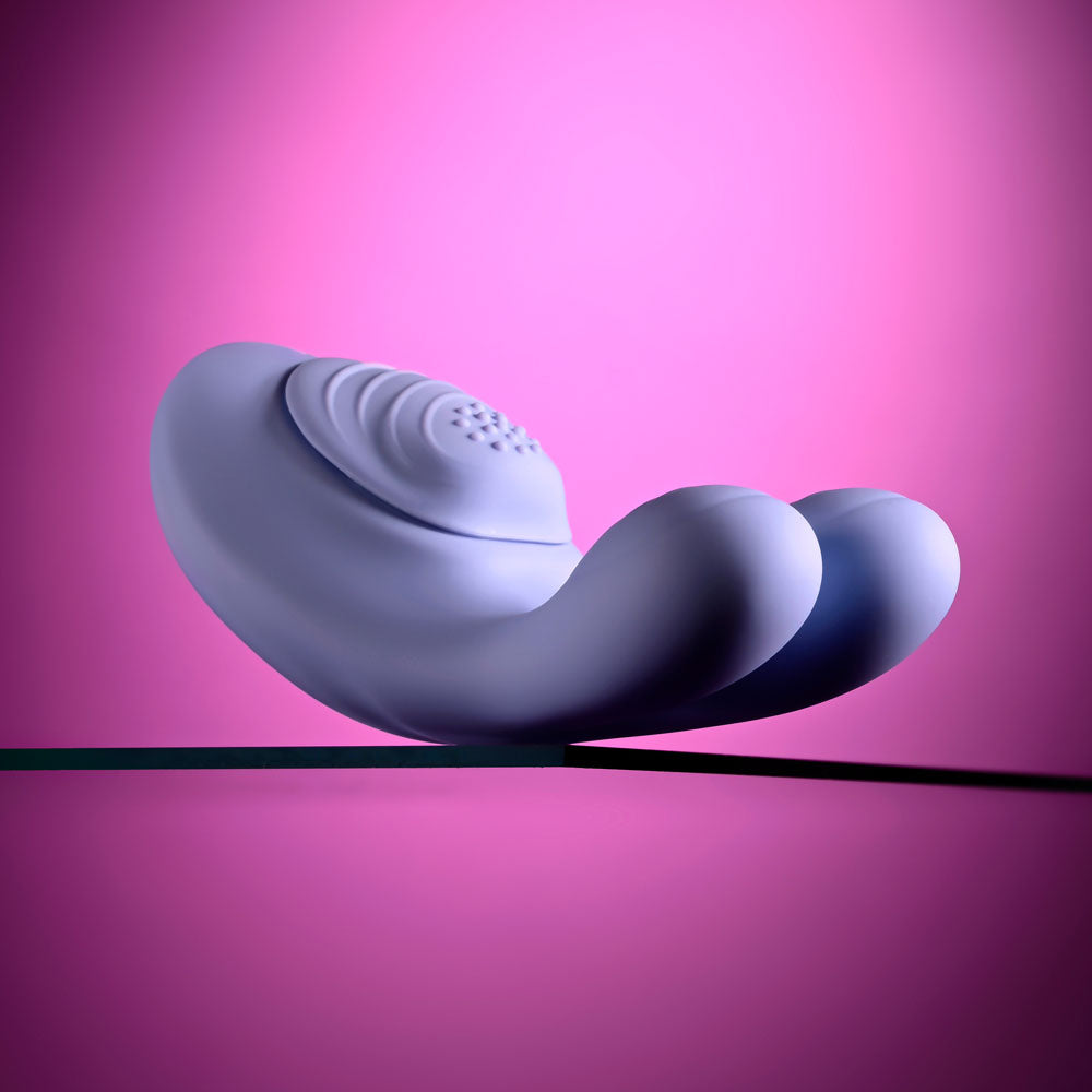 Handsy lying on its side with the dimpled textured pad facing up