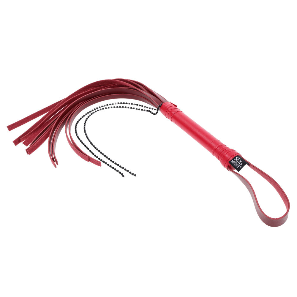 The S&M Exs & Ohs Crystal Flogger is a striking red faux leather whip with several flat tassels and black chain details. Featuring an expertly wrapped handle with a hanging loop, its perfect for impact play or as a decorative piece.