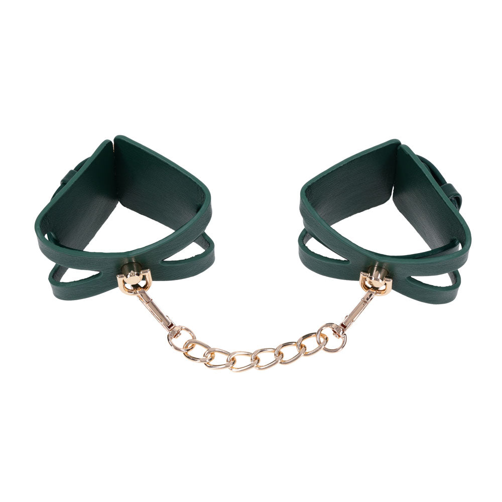 Indica cutout cuffs opened wide with the gold chain stretched between