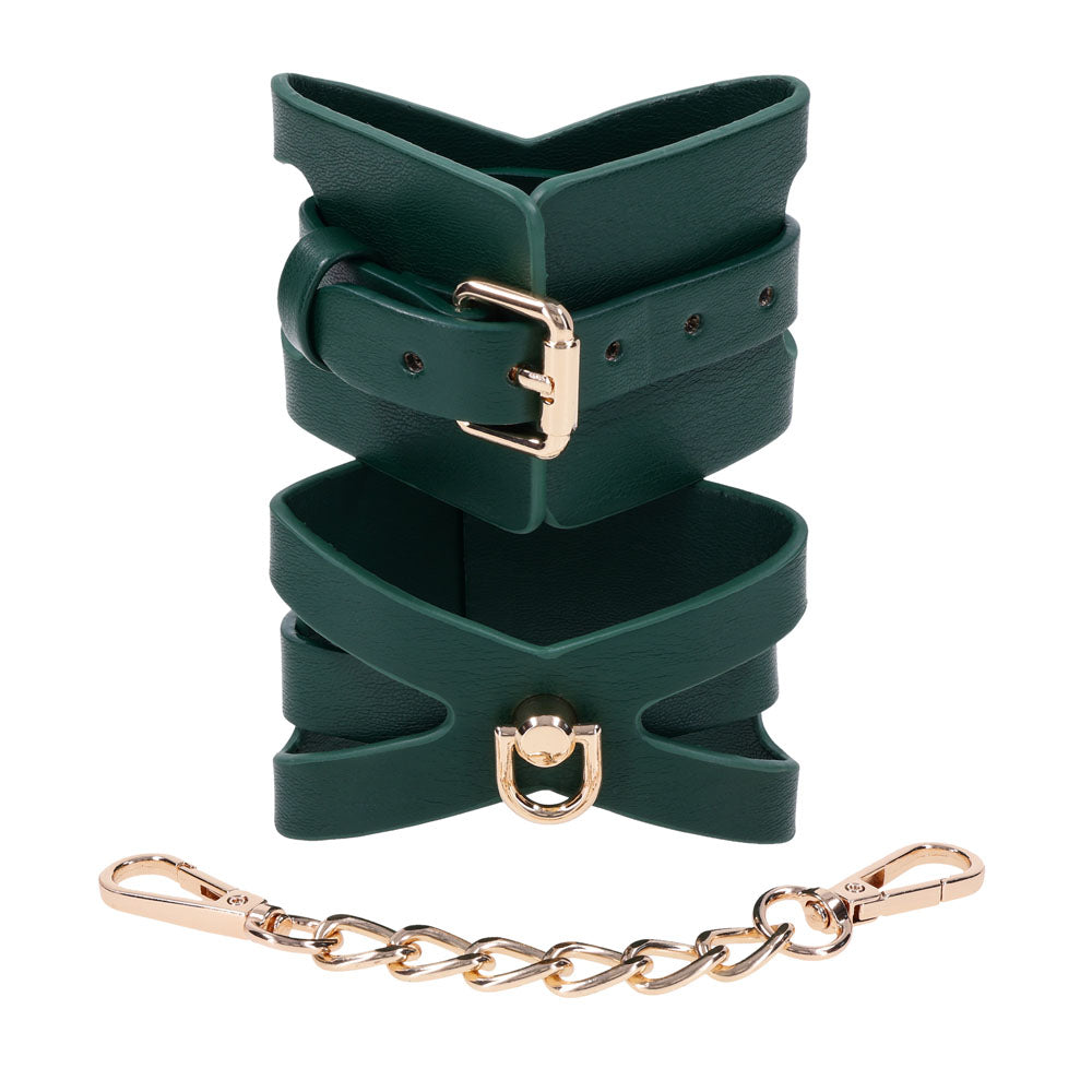 Green Indica cuffs stacked to show the buckle, gold chain and clips below
