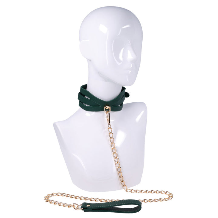 Indica cutout collar on a white mannequin bust with the gold chain leash hanging