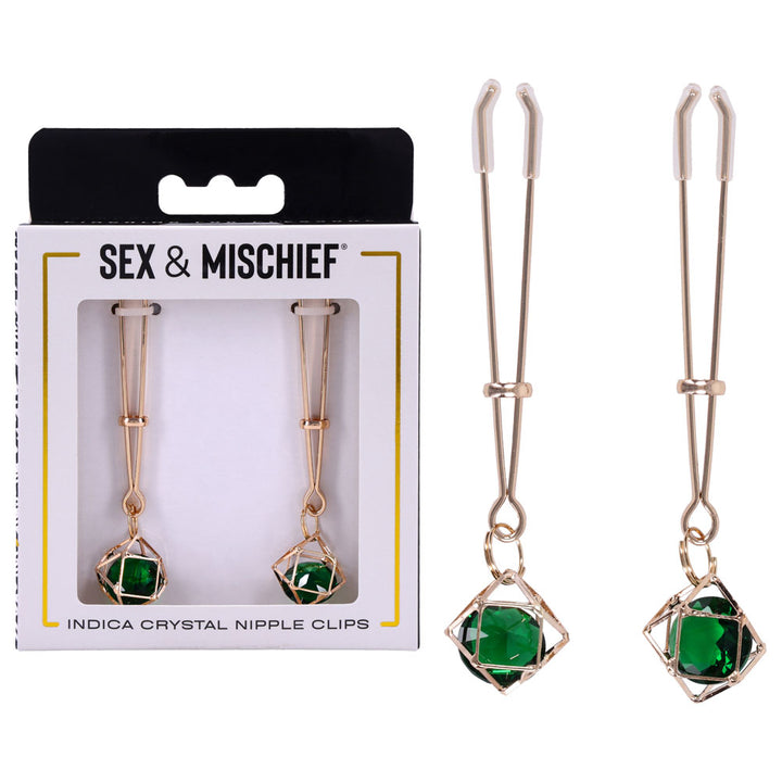 Sex & Mischief Indica Crystal Nipple Clips box beside two gold clips with green gems
