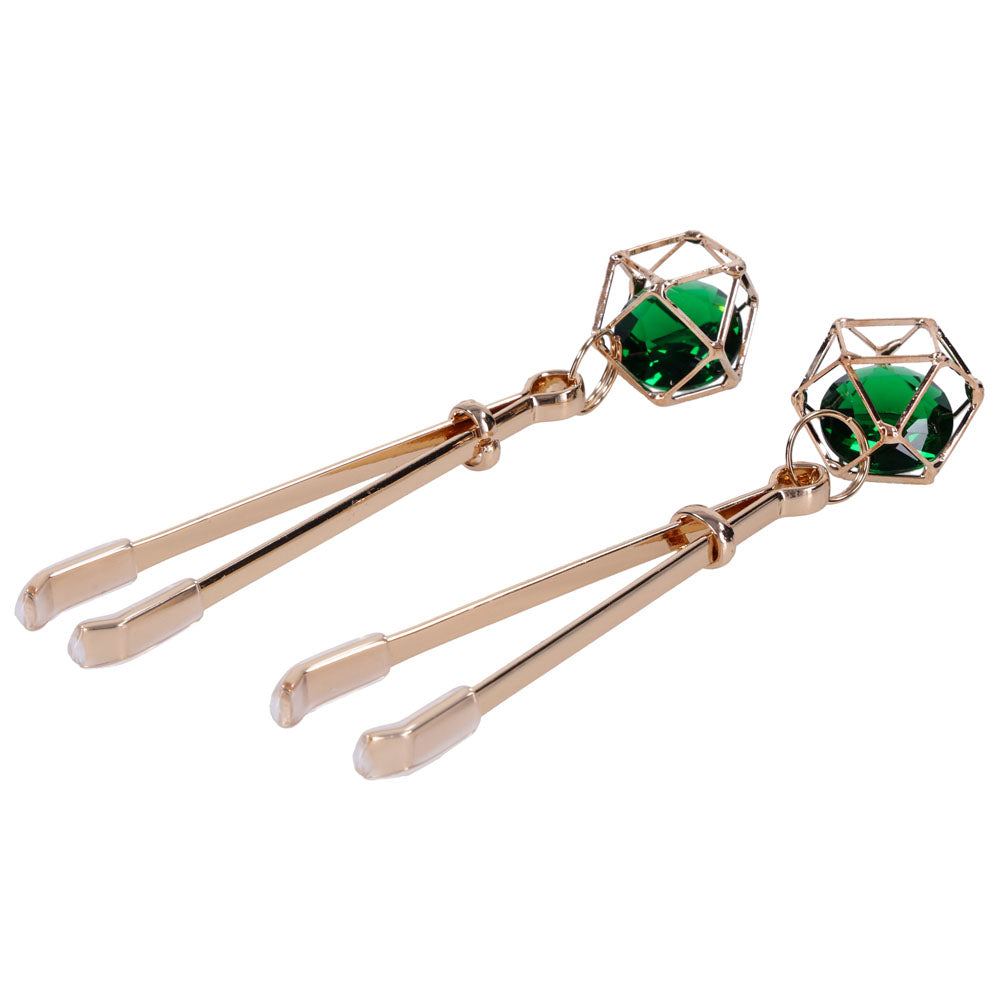 Indica crystal clips laid diagonally with the green gems uppermost
