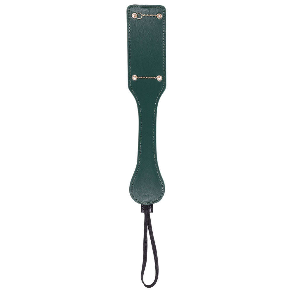 Indica paddle turned over to its plain green reverse side