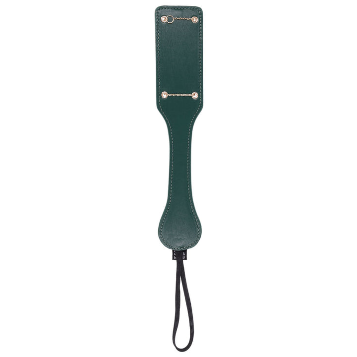 Indica paddle turned over to its plain green reverse side