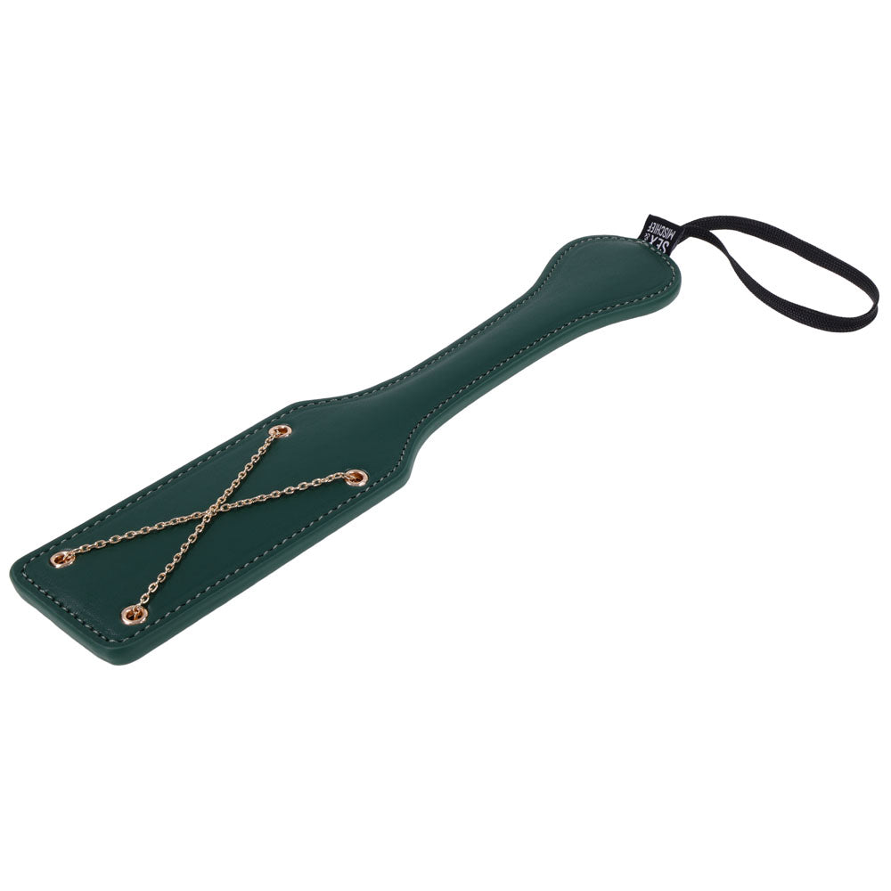 Green Indica paddle lying at an angle, gold chain X and wrist loop in view