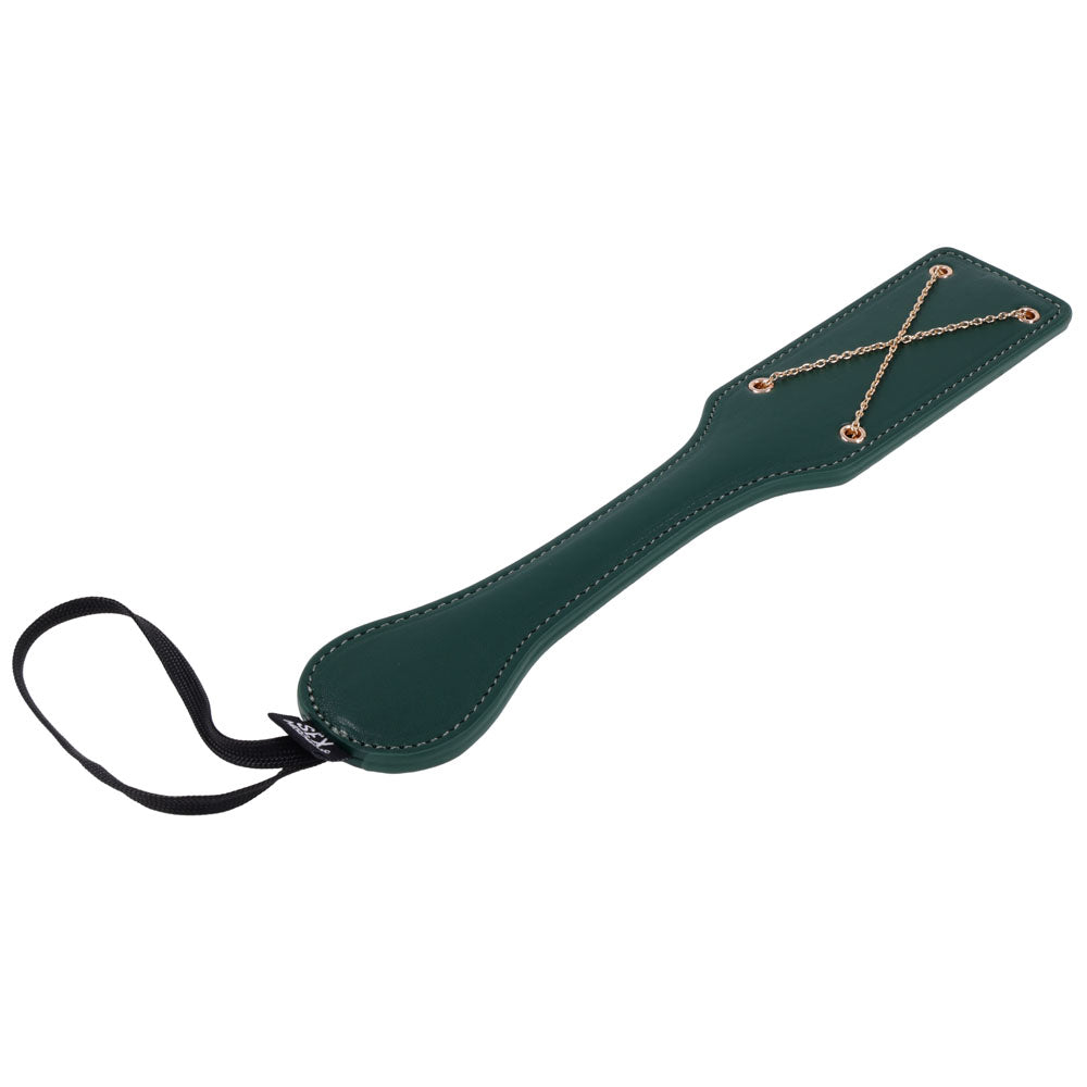 Indica paddle angled with the blade upper right and the wrist loop trailing