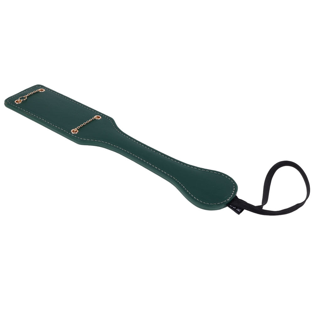 Indica paddle laid diagonally, showing the shaped handle and stitched edge