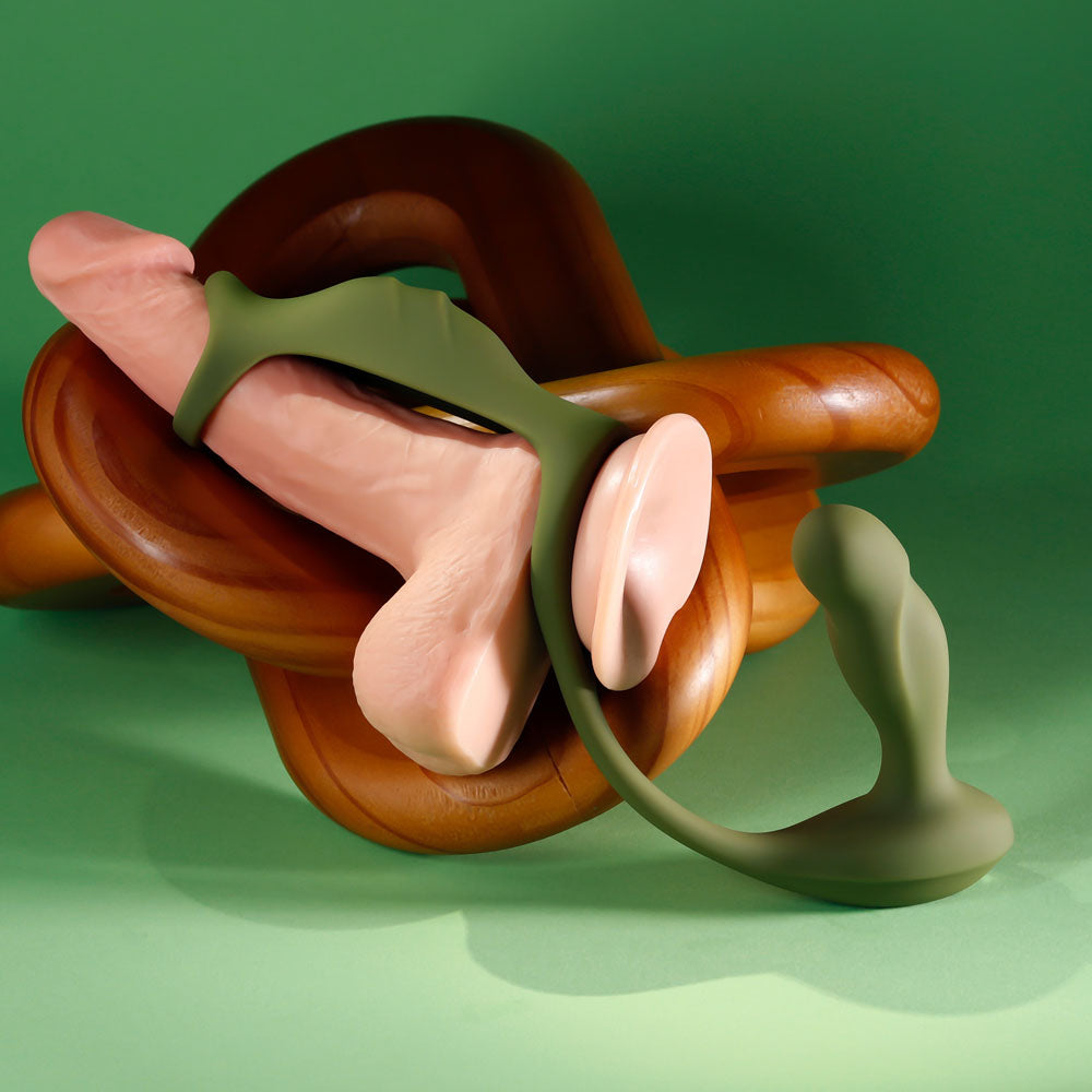 Prostate Power Pack fitted over a flesh-tone demo dildo on wooden rings