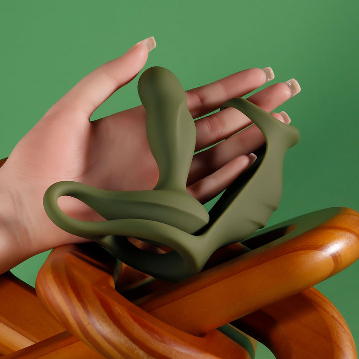 The green Prostate Power Pack held in a hand to show its size