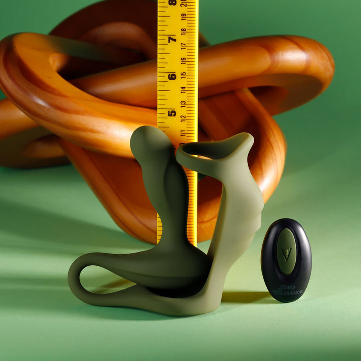 Prostate Power Pack measured against a ruler with the remote alongside