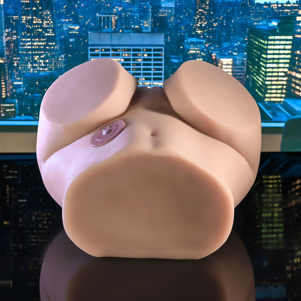 Rumble masturbator front on, showing the navel and the round control disc
