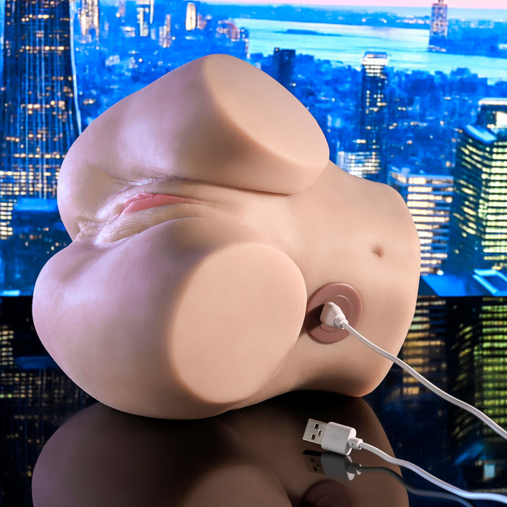 Rumble masturbator with its USB charging cable plugged into the base