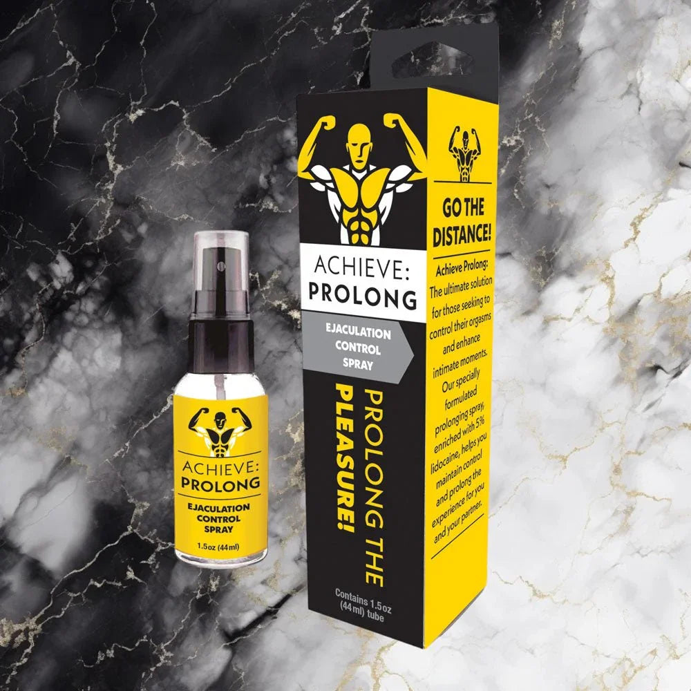 Achieve Prolong spray and carton on a black and gold marble surface