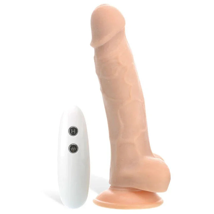 True Feel rechargeable dildo in Flesh, upright beside the two-button remote