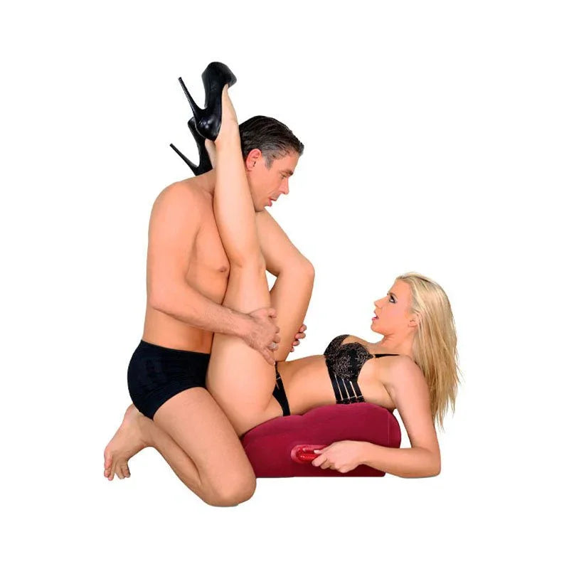 Red body pillow with integrated vibrator, silicone, curved design for couples use.