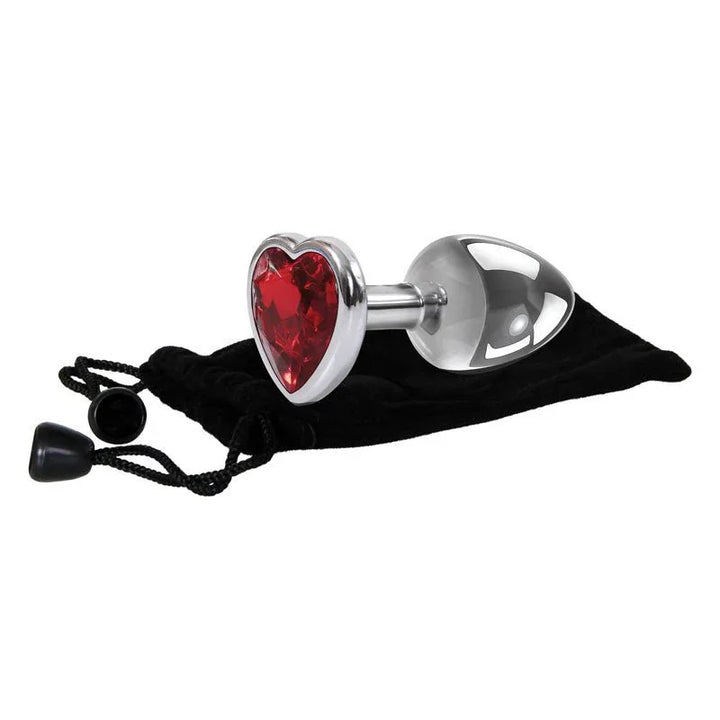 Red Heart Gem plug lying on its black velvet pouch, heart base up