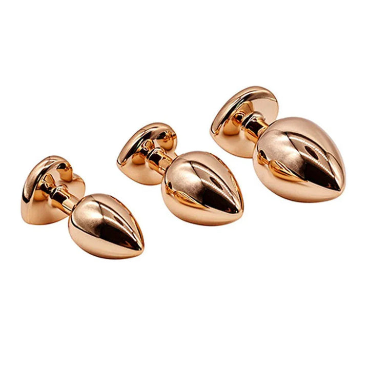 Rose Gold Heart Gem set lying flat, polished rose-gold taper view
