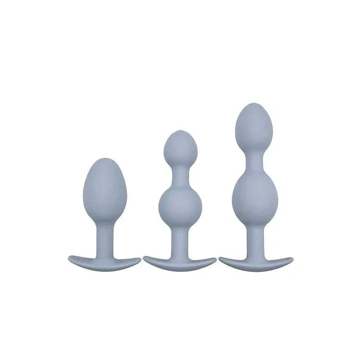 Vibra-Ball Trio in Grey, the three anchor-base plugs lined up by size