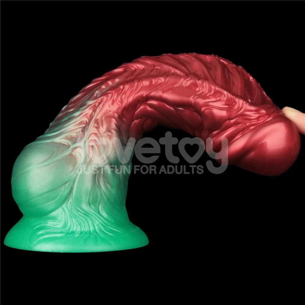 Aerosx 8 inch dildo curled forward on its green suction base, showing how far the shaft bends