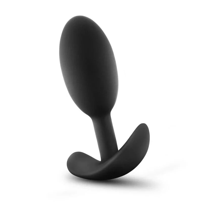 Medium black Vibra Slim Plug standing at an angle against white