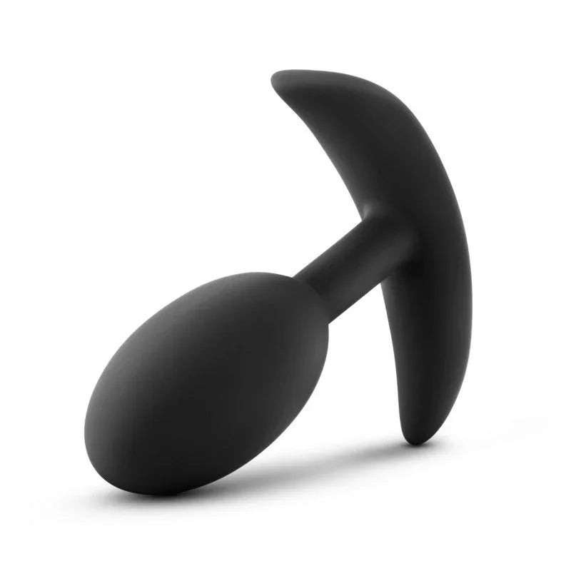 Medium Vibra Slim Plug lying on its side, T-bar base to the right