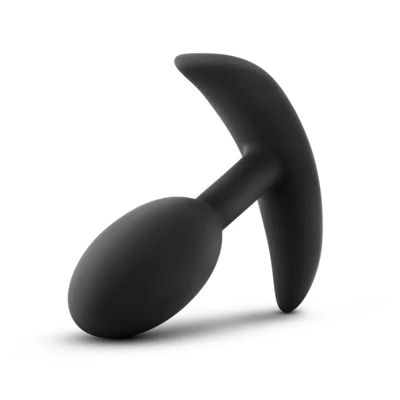 Small Vibra Slim Plug lying on its side with the flexible base to the right