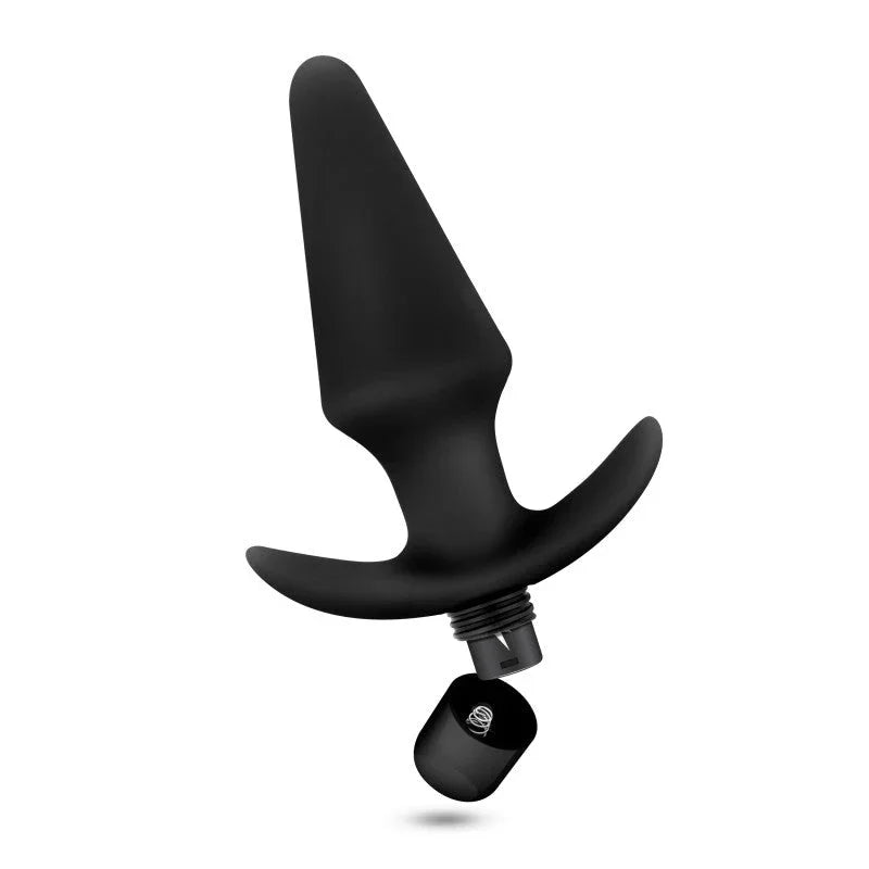 Black Platinum plug tilted with its bullet motor detached and sitting below