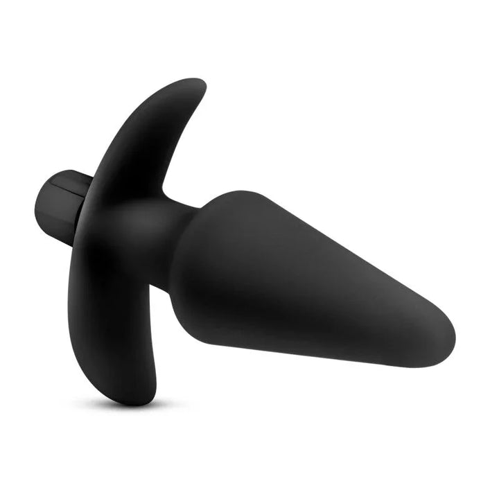 Black Platinum vibrating plug lying on its side, anchor base and bullet to the left
