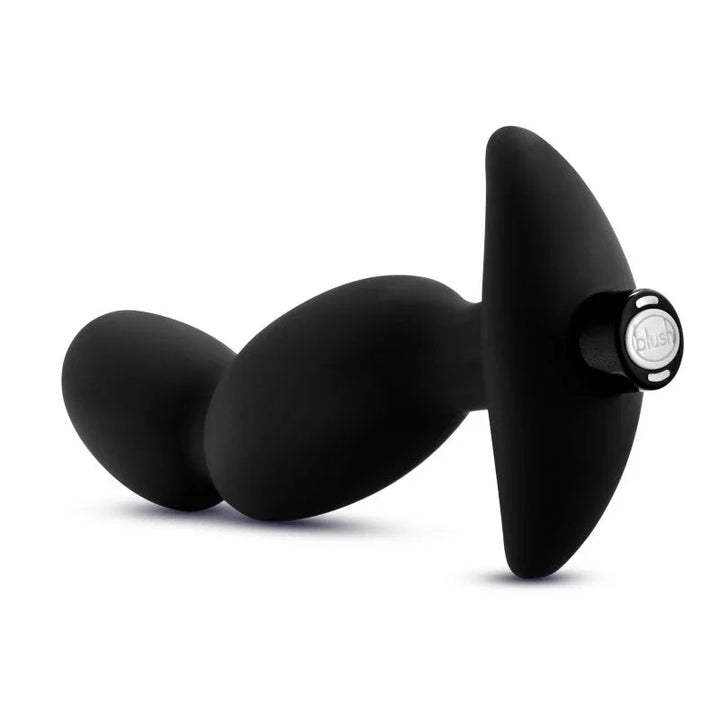 Prostate massager 04 lying down with the branded base disc turned to the camera
