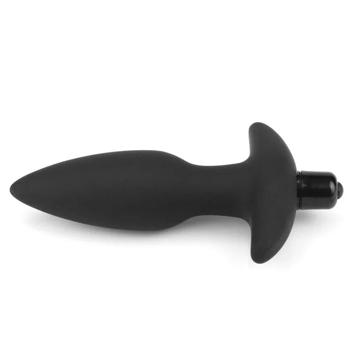 Black silicone anal plug lying flat, tapered tip pointing left, bullet in the base