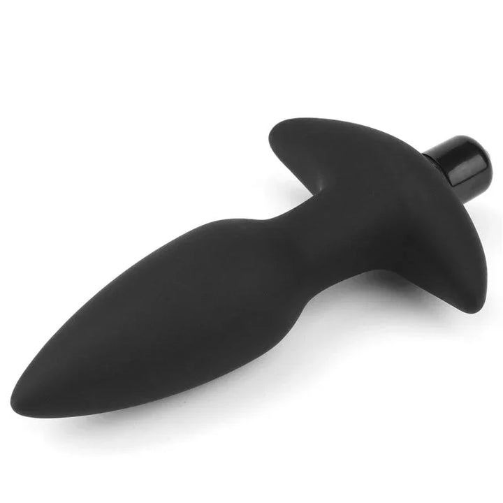 Black vibrating anal plug from above, showing the anchor-shaped base and tapered body