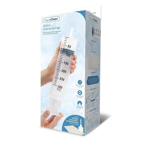 AquaClean 300ml Enema Syringe retail box, graduated clear syringe shown in a hand